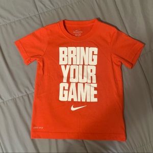 Orange Nike T-shirt. Size 7.